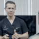 Dr. Tyler Frew explaining staged mommy makeover surgery options during a consultation